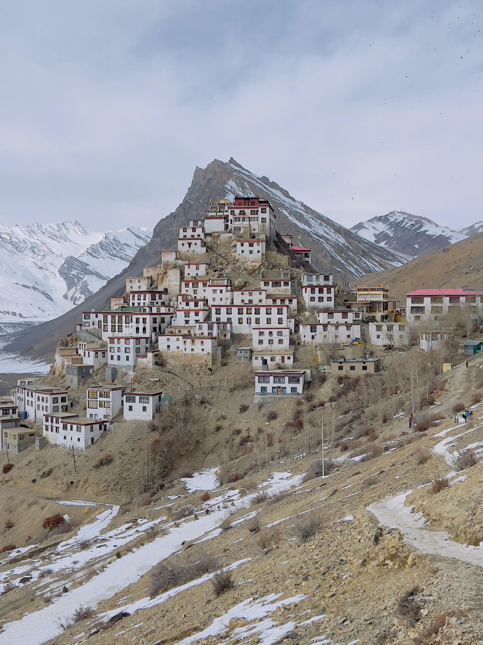 A stunning view of Ki Monastery nestled in the snowy Spiti Valley, Himachal Pradesh, India.